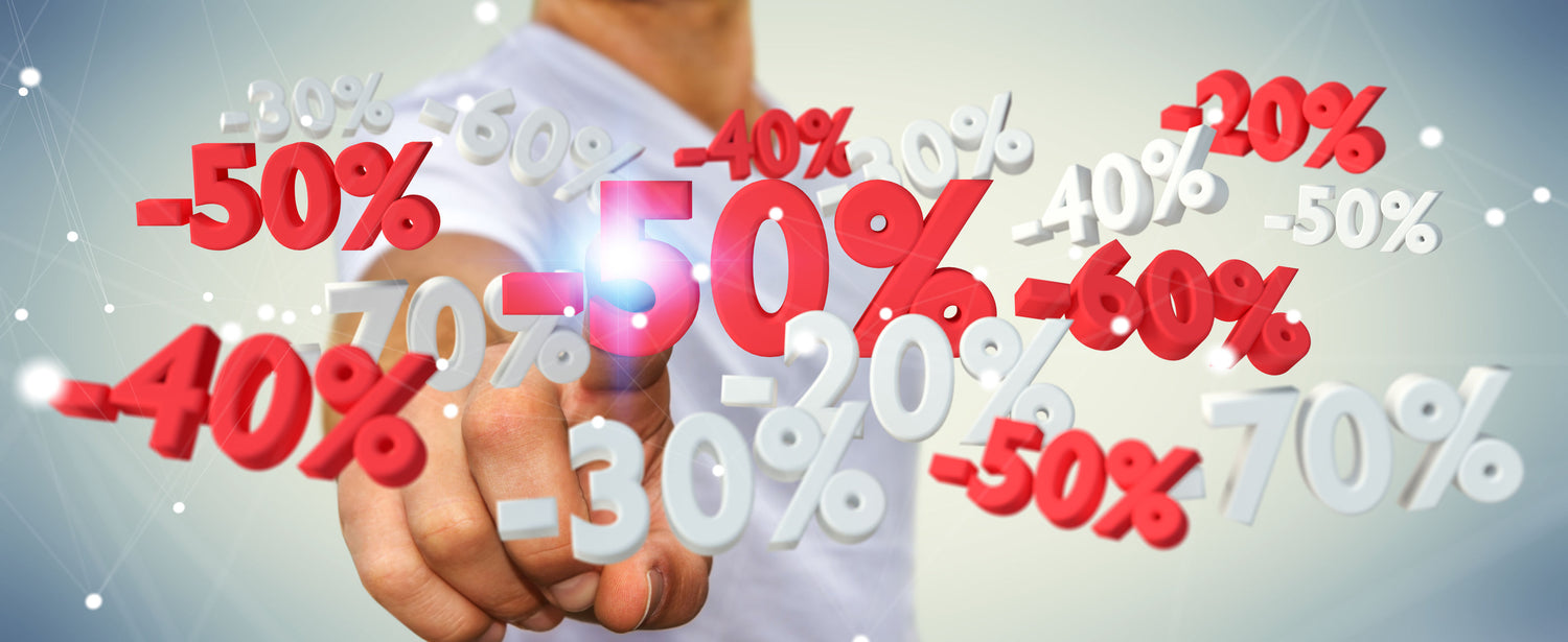 Hand pressing a digital screen with various percentage discounts displayed.