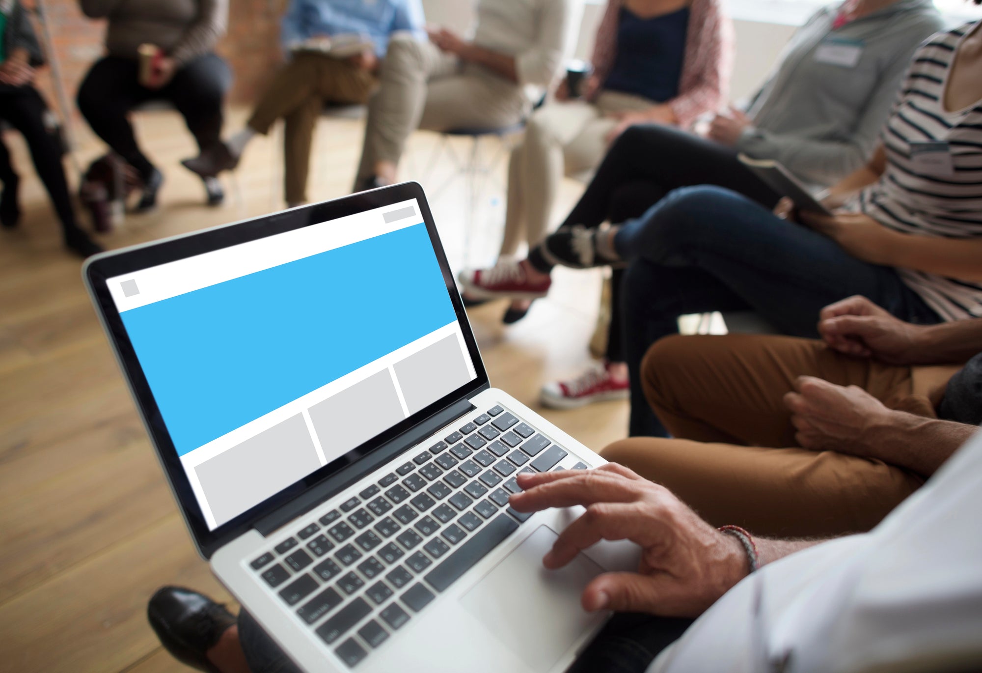 Small business owner working on laptop with website analytics dashboard